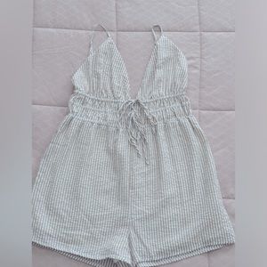 Never worn! Vacation Getaway Romper. Tan and white striped.